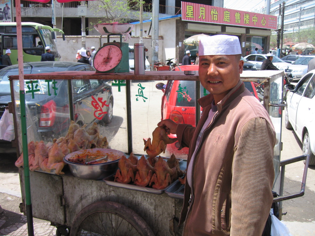 Hui man selling chickens